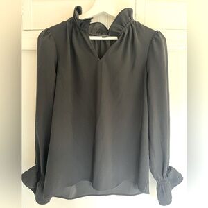 Banana Republic long sleeve shirt with ruffles at neck and sleeve.